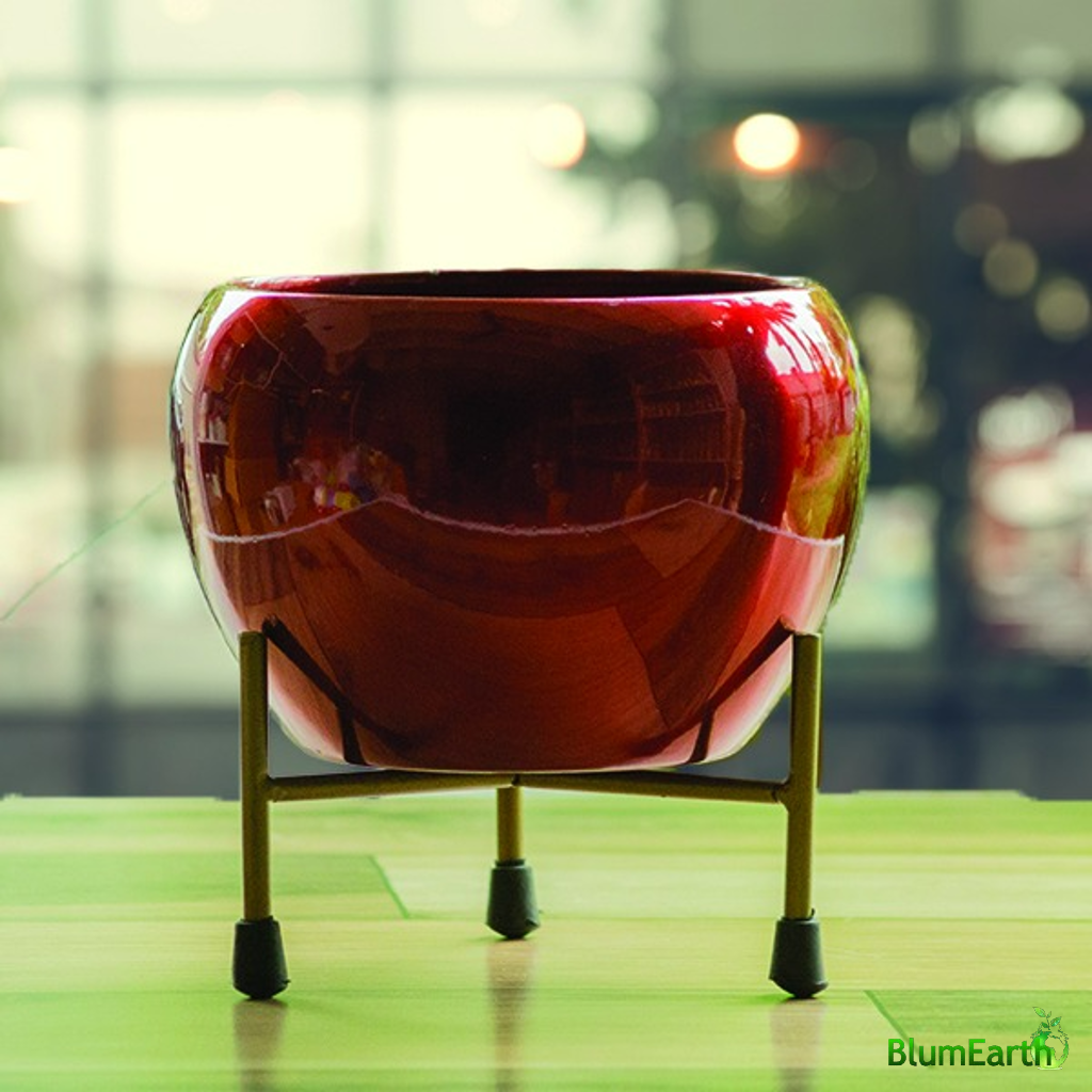 Glossy red round metal pot with stand